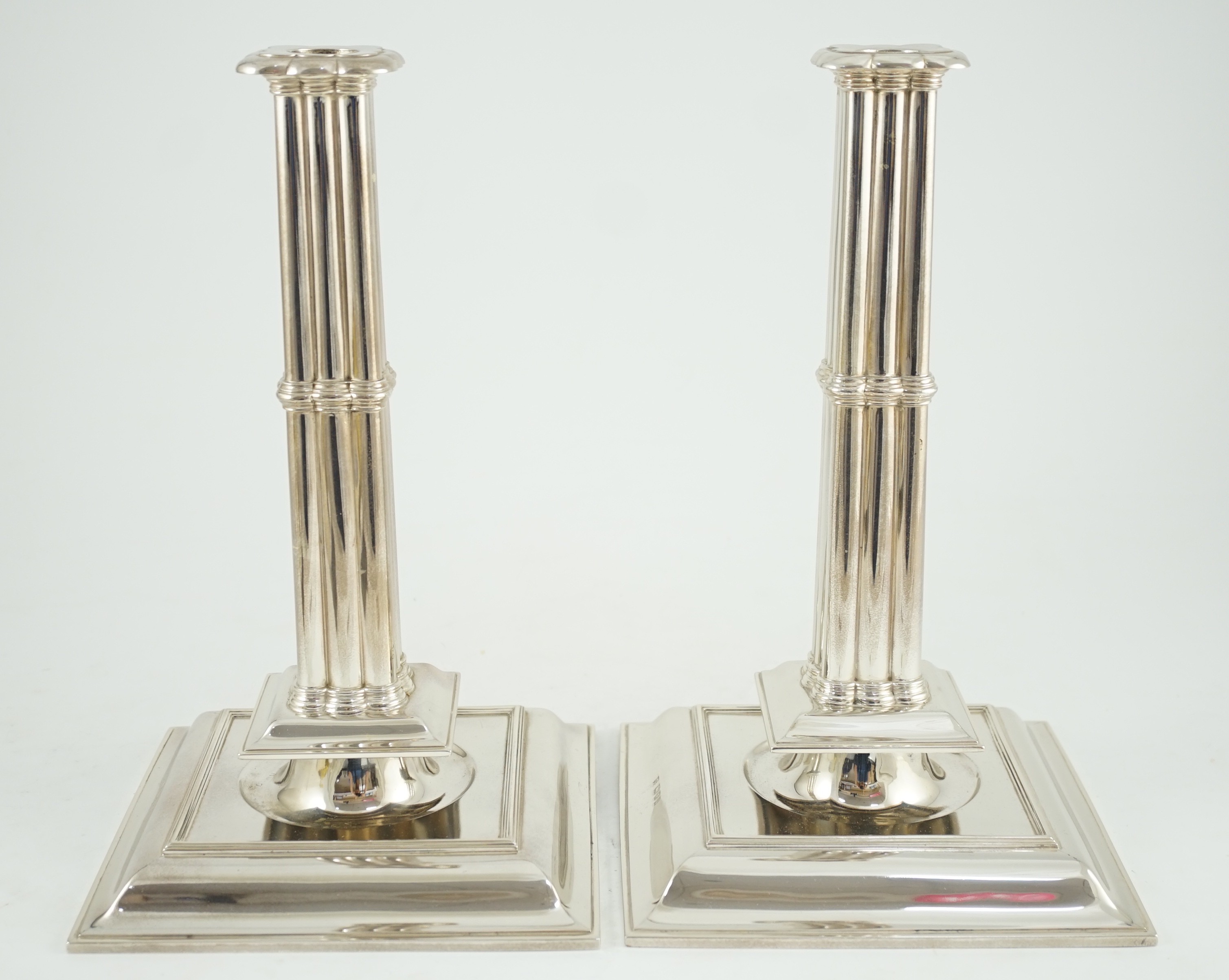 A large pair of George V silver cluster column candlesticks, by William Comyns & Sons Ltd